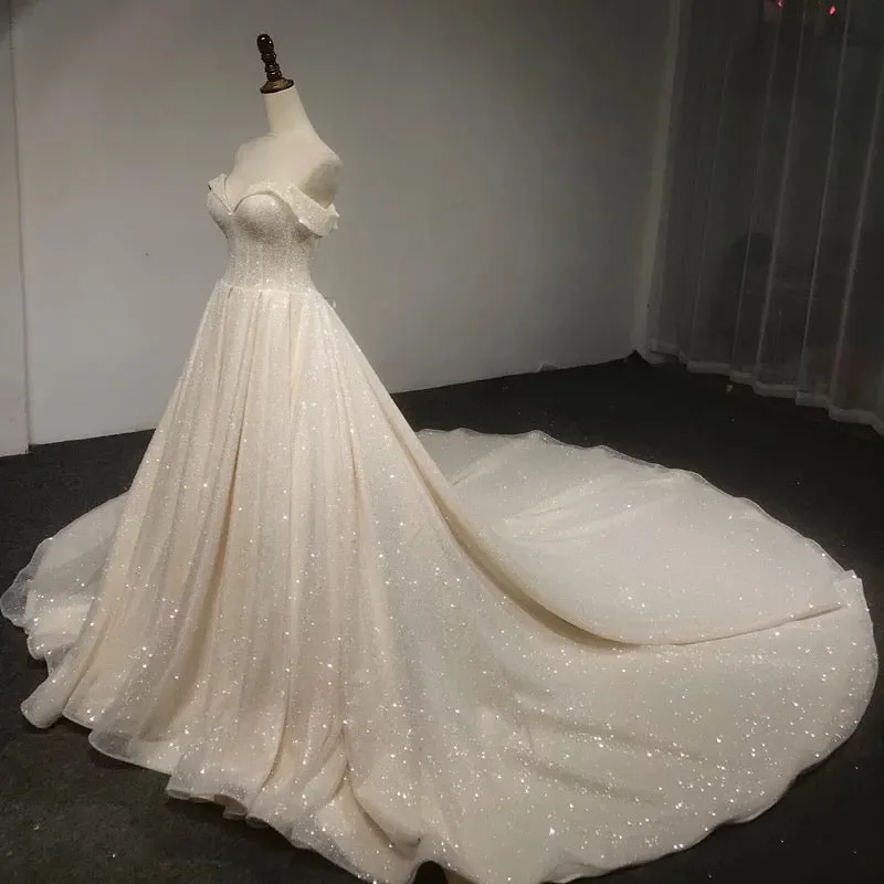 Off shoulder cape glitter fabric shiny looking ball gown skirt bride gowns with ivory and off white color